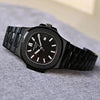Luxury black men’s watch with stainless steel band and modern design on gray surface