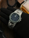 Luxury men's stainless steel watch with blue dial on black glove, Ministry of Mens Affair