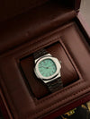 Luxury men’s silver wristwatch with mint green dial, in brown leather display box