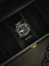 Black men's luxury digital watch in a display case, stylish modern design