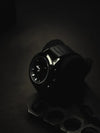 Luxury men's black wristwatch with leather strap on dark background, Ministry of Mens Affair